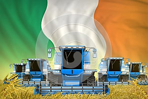 Some blue farming combine harvesters on grain field with Ireland flag background - front view, stop starving concept - industrial