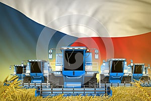 Some blue farming combine harvesters on rye field with Czechia flag background - front view, stop starving concept - industrial 3D