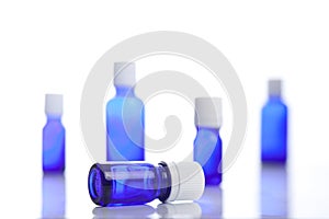 Among some blue vials the focus on the invested vial