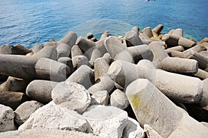 Some breakwaters at Amafi beach in Naples, Italy