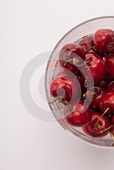 Some cherrys in a glass