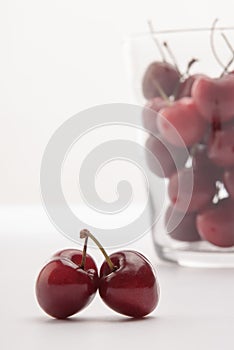 Some cherrys in a glass