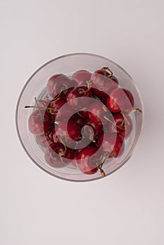 Some cherrys in a glass