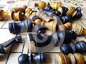 Some chess pieces put on wooden carrom board