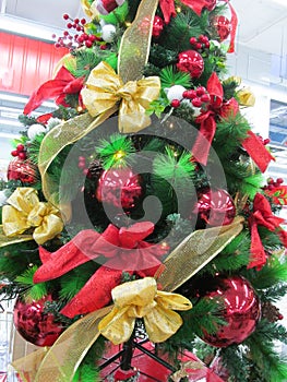 Some colorful Christmas trees with decorations at a departmental store