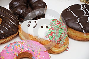 Some colorful donuts of different flavours