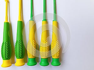 Some colorful screwdrivers on a white background