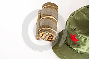 Cuban cigars rolled in banana leaf and military cap with red sta photo