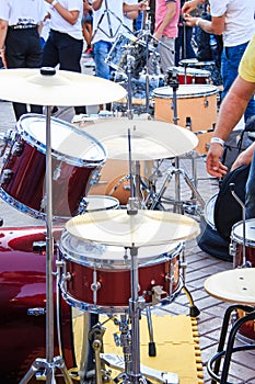 Some different drum kits after outdoor performance of street artists