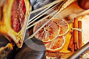 some dried orange slices with cinnamon straws