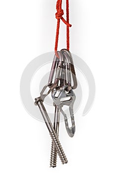 Some equipment for mountain climbing on a white background