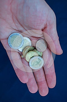 some euro coins in the palm of my hand