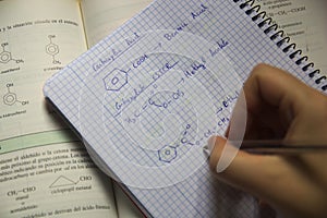 Some formulas of organic chemistry in a student`s class notebook.