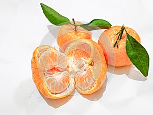 some fresh citrus fruit with stems and leaves as a healthy source of vitamin C and anti-oxidants : Santang orange, Ponkam Orange