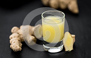 Some fresh Ginger Drink selective focus; close-up shot