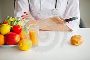 Some Fruits Such As Apples, Kiwis, Lemons And Berries On Nutritionist Table