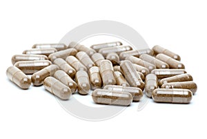 Some homeopathic brown pills photo