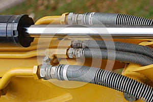 Some industrial hydraulics shaft and fluid hoses photo