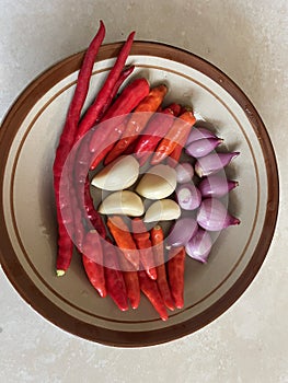 Some of the ingredients for traditional Javanese chili sauce are shallots, garlic and chilies.