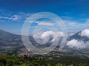 some movement of clouds over mountains