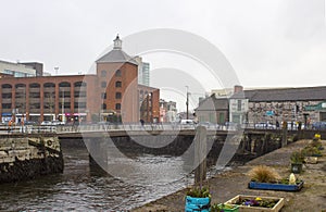 Some of the narrow streets of Cork Ireland on the Father Mathew Quay alongside the River Lee that runs through the city