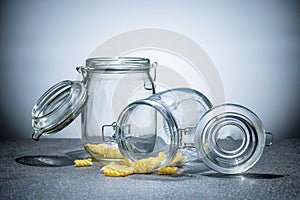 Some pasta in two glass jar on the kitchen table