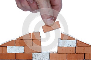 Some red and white bricks symbolic house build