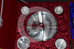 Some silverware in a red jewelery box