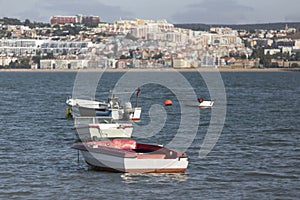 Small old fishing boats on the tajo river near lisbon portugal