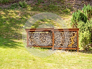 Stacked firewoods in a field