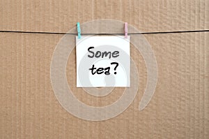 Some tea? Note is written on a white sticker that hangs with a c