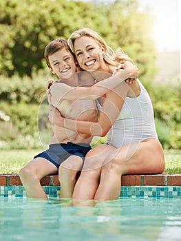 Some time by the pool is just what we needed. a woman and her young son bonding by the poolside.