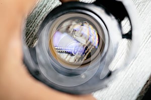 Some tiny screws seen on a loupe lens