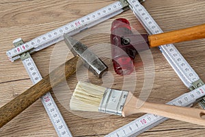 Some tools, hammer, brush, pocket rule, folding meter stick...