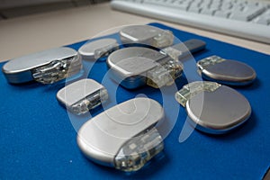 Various explanted pacemakers and defibrillators and event recorders photo