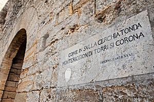 Some verses of the Divine Comedy by Dante Alighieri on a commemorative plaque, along the city walls, near the Porta