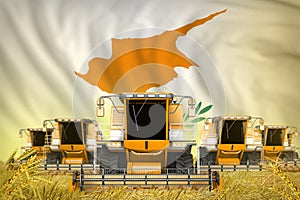 Some yellow farming combine harvesters on grain field with Cyprus flag background - front view, stop starving concept - industrial