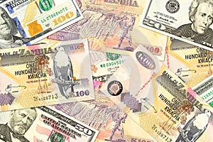 Some zambia kwacha bank notes and us dollar bank notes mixed indicating bilateral economic relations