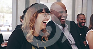 Somebody actually told a funny joke. 4k video footage of a group of businesspeople laughing during a conference.