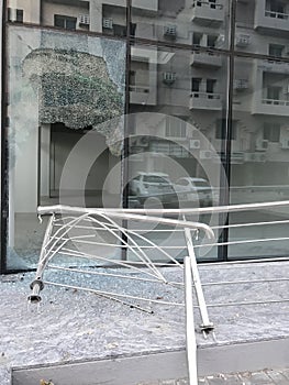 Somebody broke toughened glass partition for stealing the things from an commercial shopping center