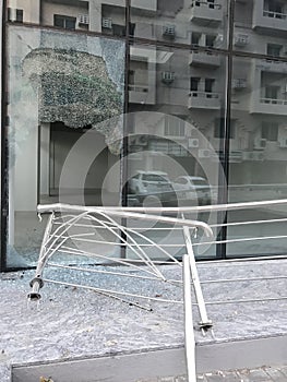 Somebody broke toughened glass partition for stealing the things from an commercial shopping center photo