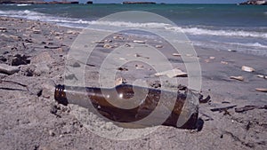 Someone abbandoned a beer bottle on the beach