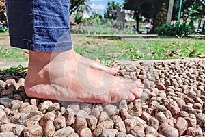 Someone is doing foot therapy on rocks photo