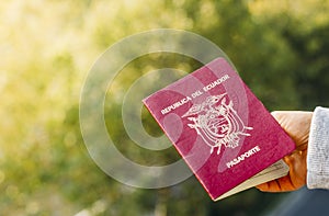Someone holding a passport from the Republic of Ecuador, isolated