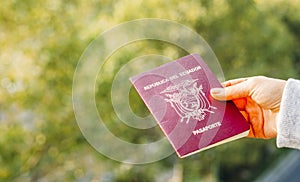 Someone holding a passport from the Republic of Ecuador, . photo