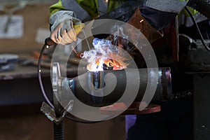 Someone welding in factory