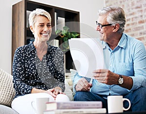 Sometimes you need someone to help you with paperwork. a senior male realtor going through paperwork with a client.