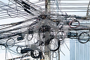 Cables at a concrete pylon in Thailand photo