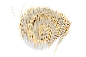 A somewhat orderly pile of toothpicks, isolated on white background