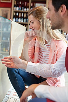 sommelier explaining red wine in wine-class photo